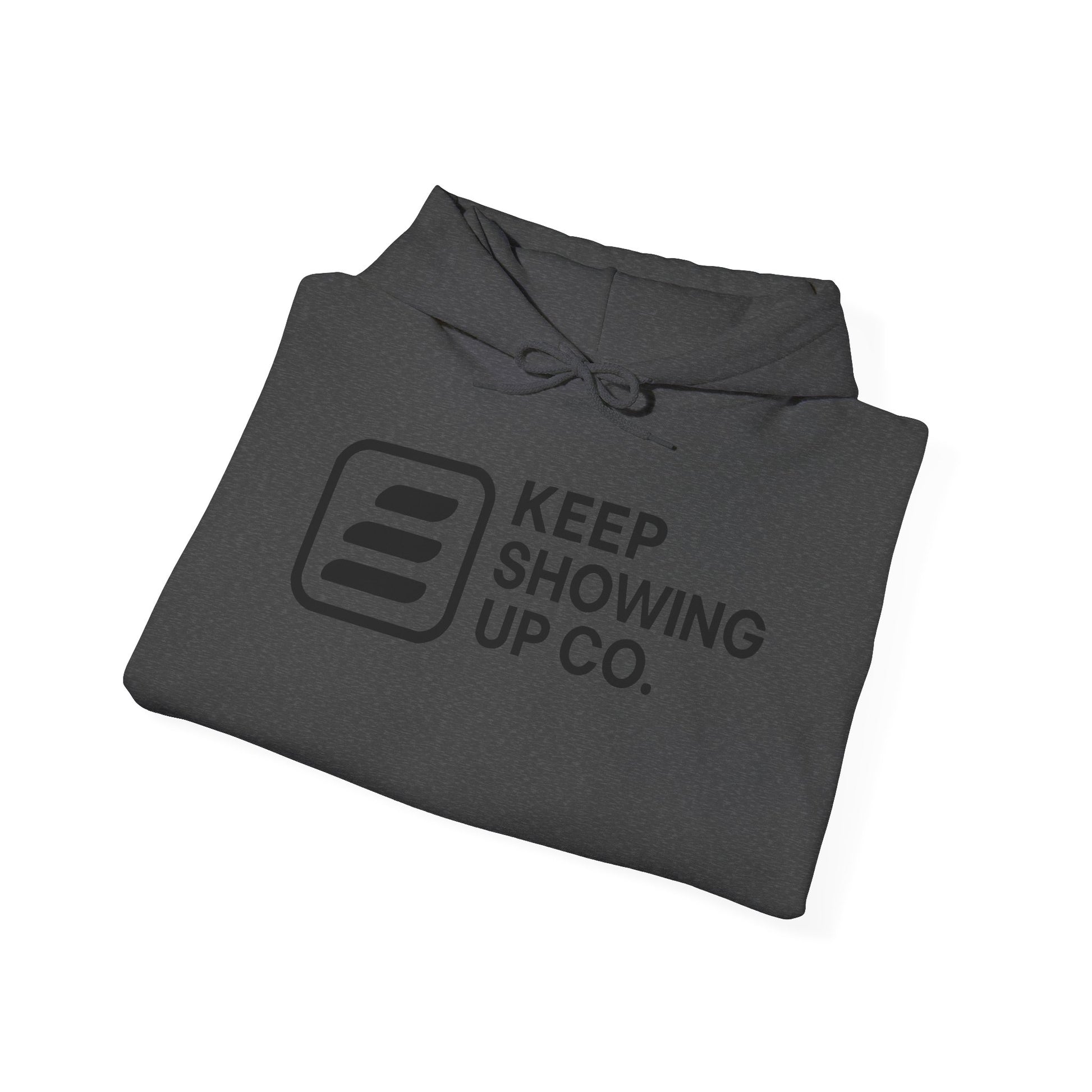 Folded gray hoodie with 'Keep Showing Up Co.' text and logo on a white background