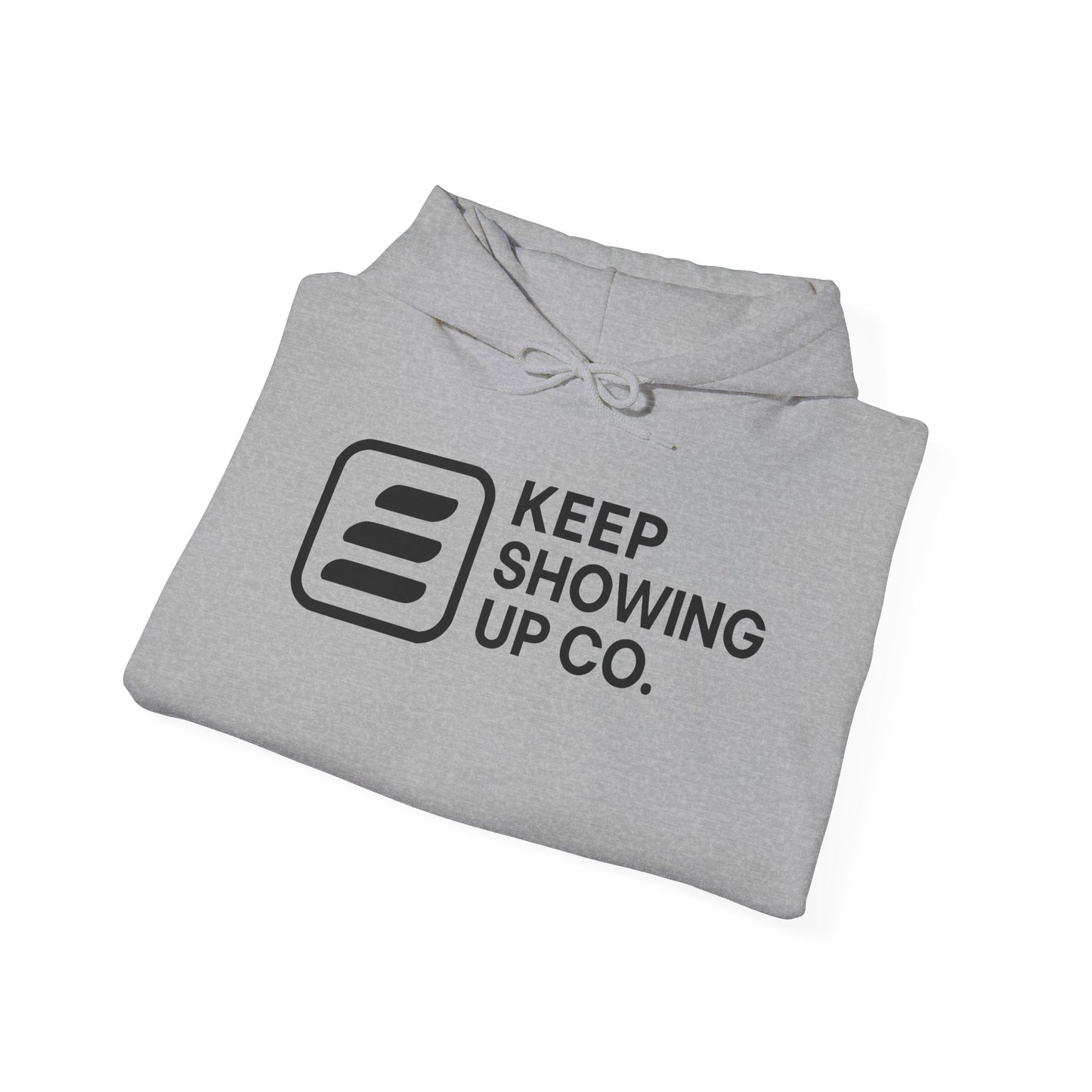 Folded gray hoodie with 'KEEP SHOWING UP CO.' text and logo on a white background