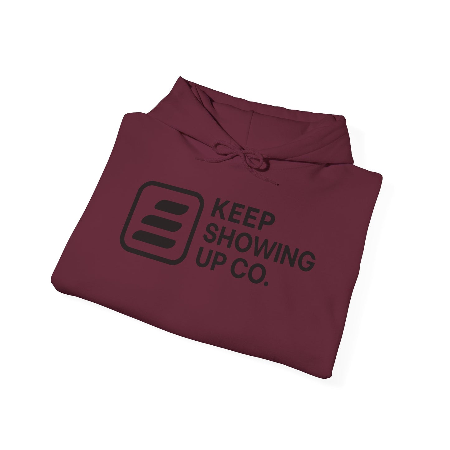 Folded maroon hoodie with 'KEEP SHOWING UP CO.' text on a white background