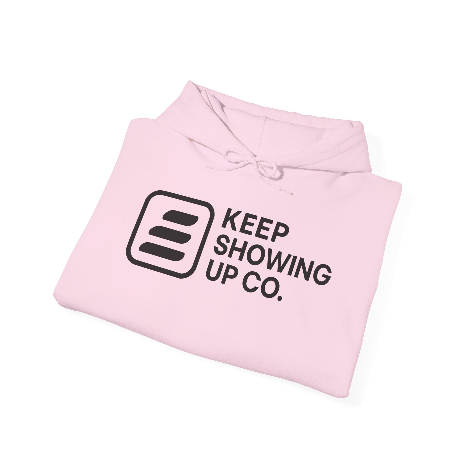 Pink hoodie with 'Keep Showing Up Co.' text on a white background